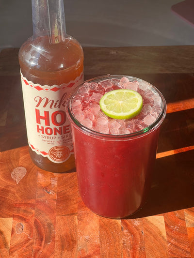 Hot honey drink with lime over ice